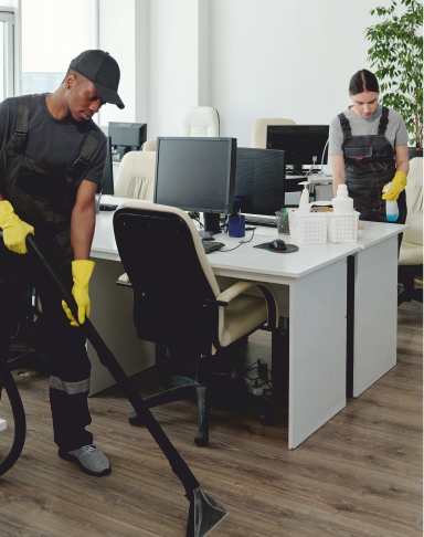 Office cleaning tips being followed by two ACS Cleaning cleaners 
